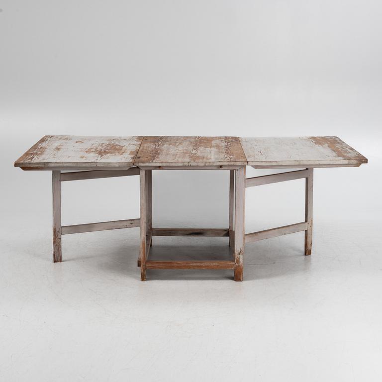 A painted gate leg table, 19th Century.