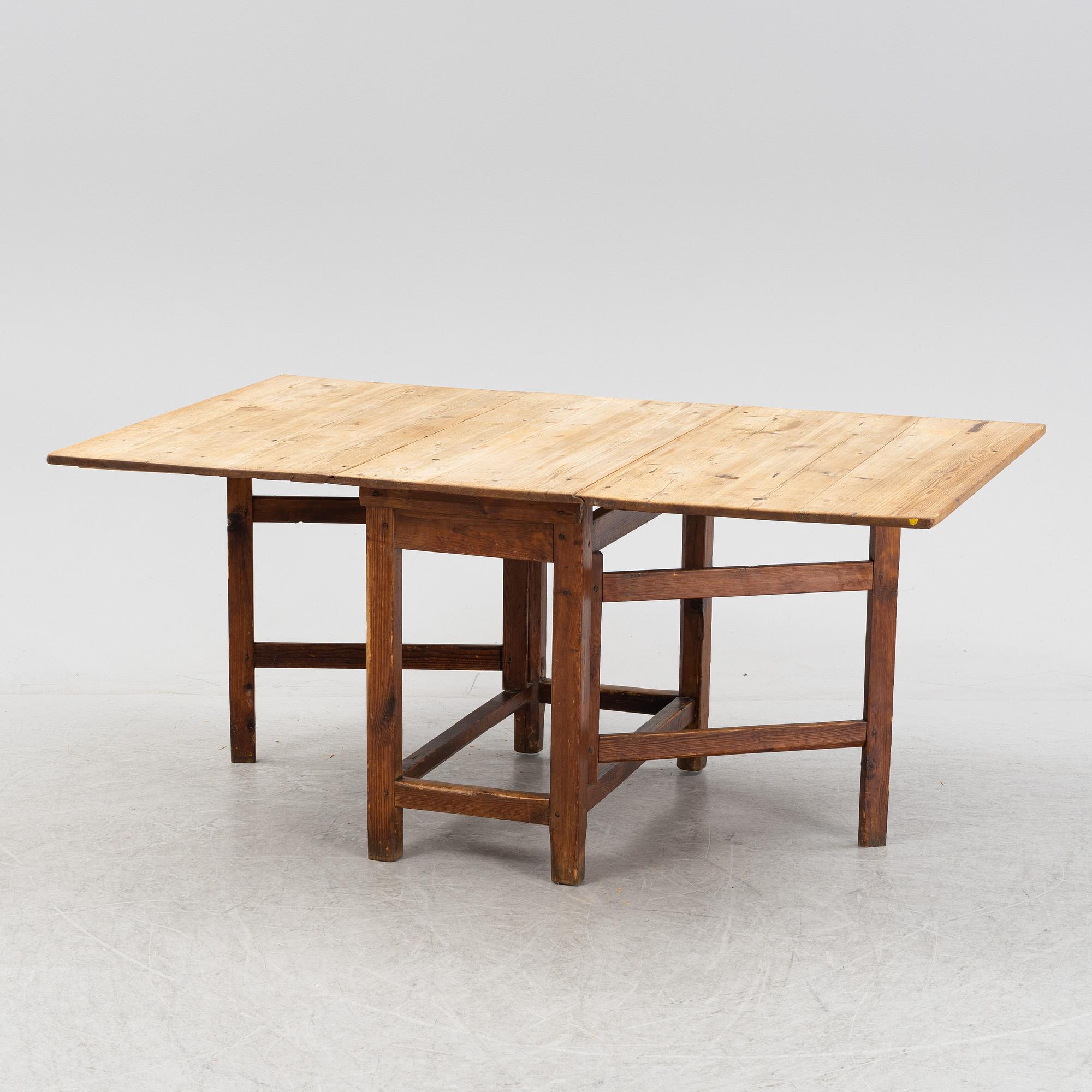A pine gateleg table, 19th Century.