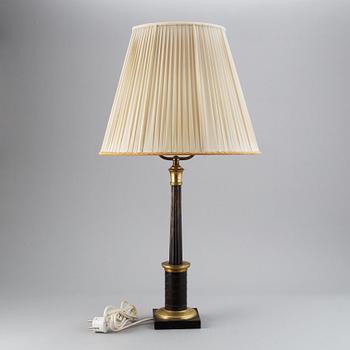 An empire style table lamp from the first half of the 20th century.