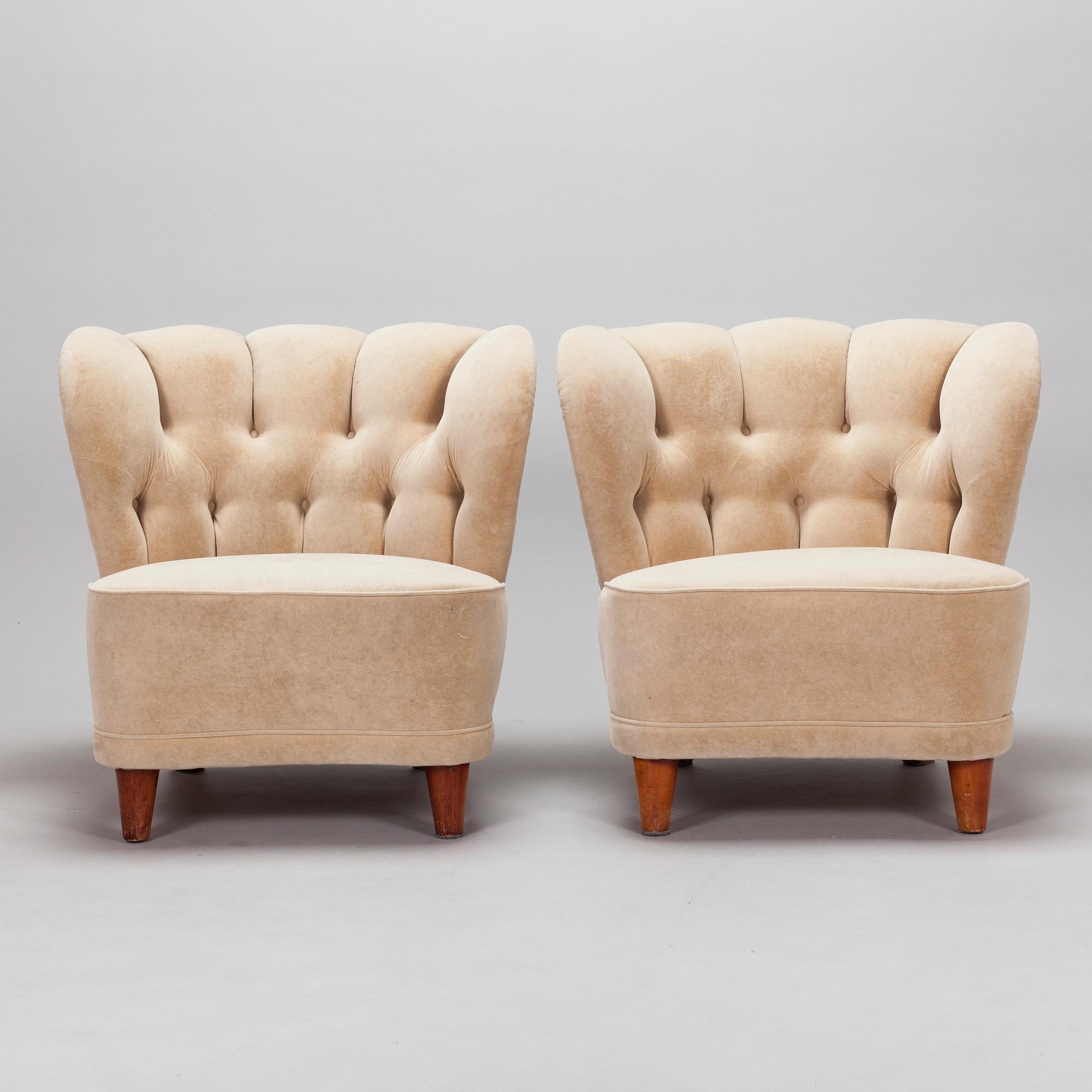 A pair of mid-20th century armchairs.