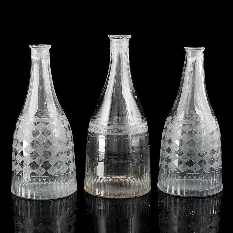 A set of three (2+1) bottles, 19th Century.
