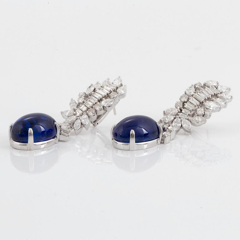 A pair of 18K gold tanzanite earings set with diamonds of various shapes.