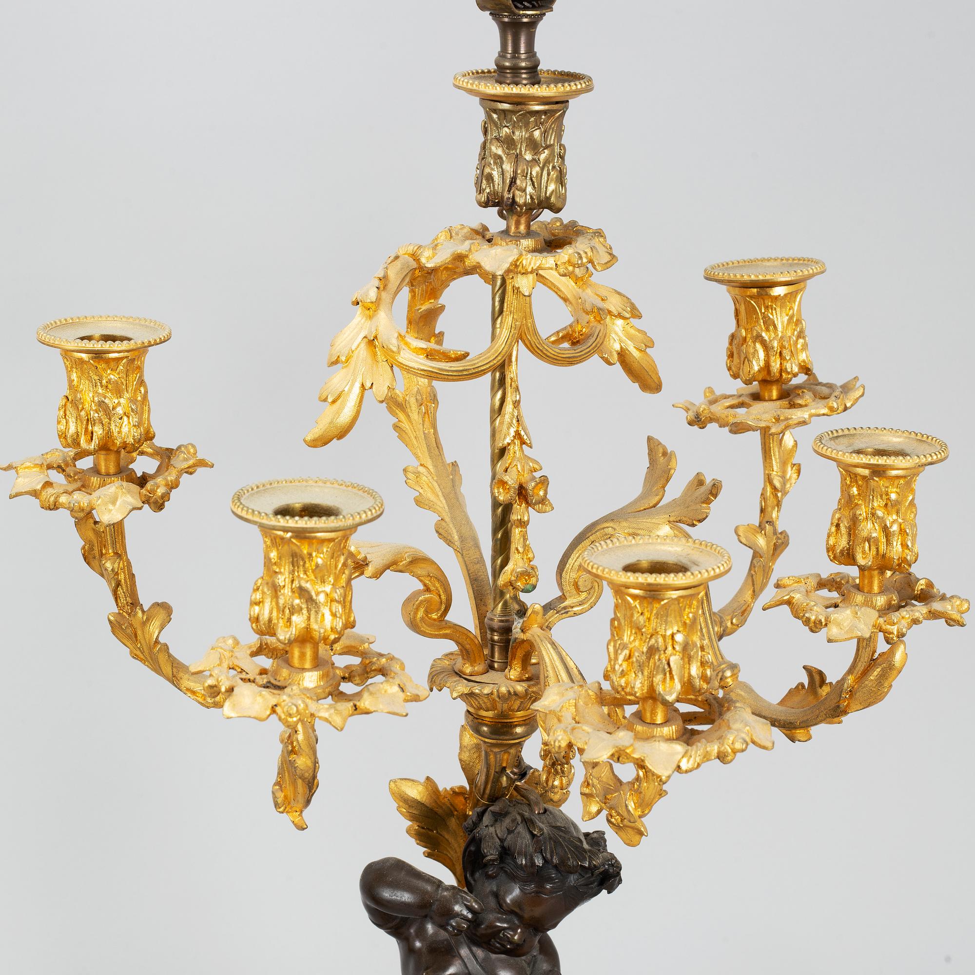A pair of  mid 19th century, rococo-style TABLE LAMPS/CANDELABRA.