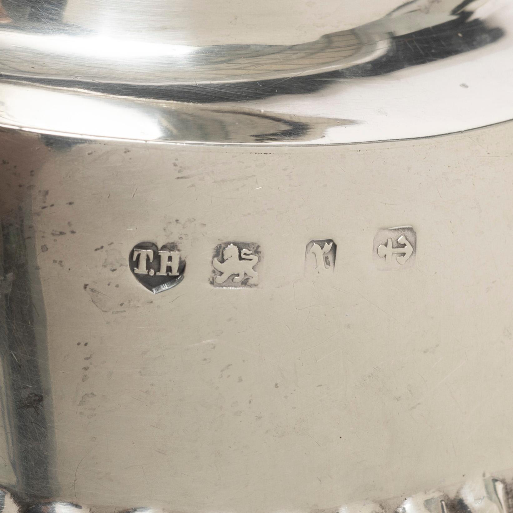 Thomas Hayes, a silver teapot, cream jug and sugar bowl, Birmingham 1897.