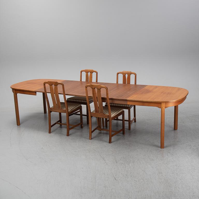 Carl Malmsten, A five-piece walnut 'Ambassadör' dining suite by Carl Malmsten.