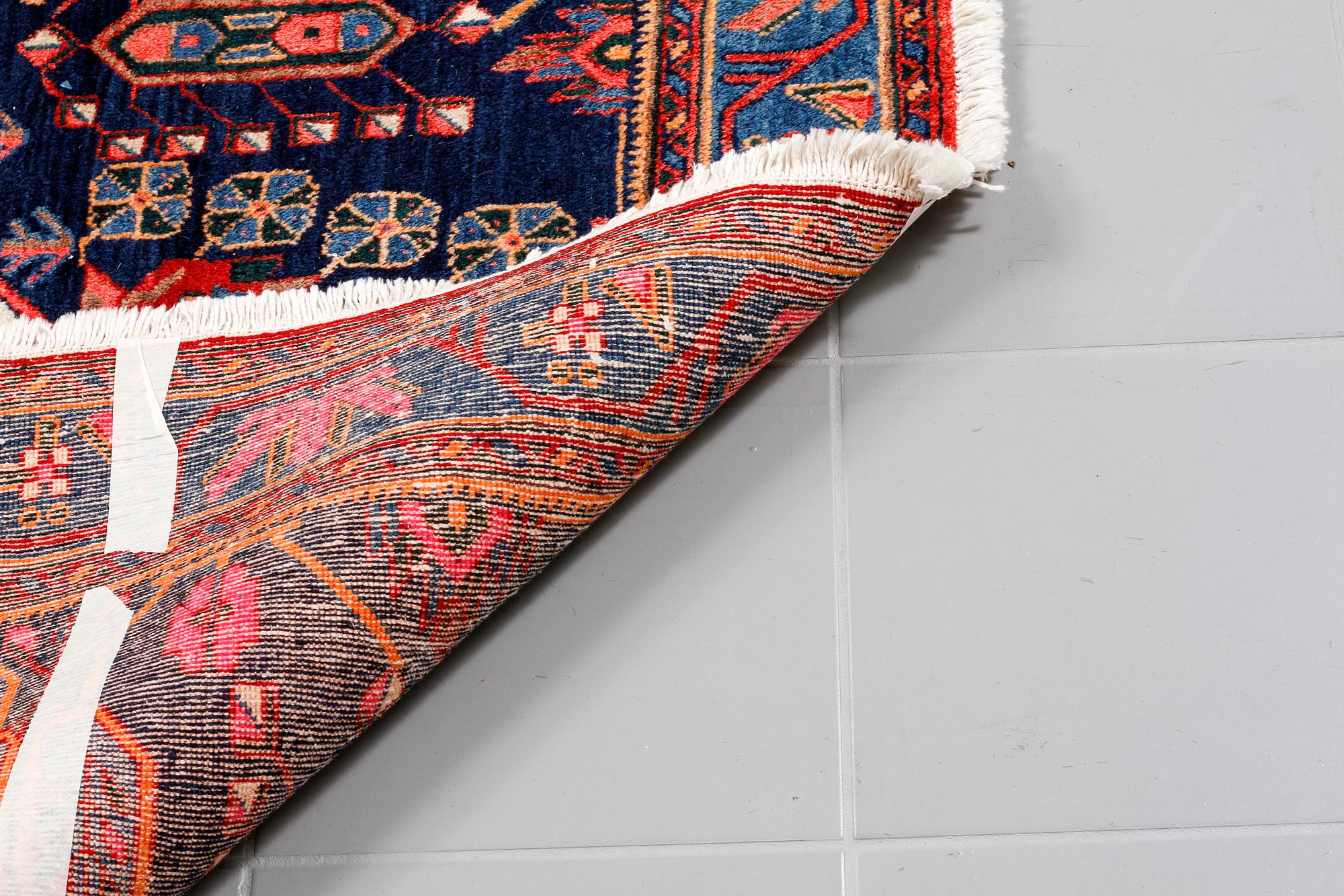 A north west persian rug, 218 x 159 cm.