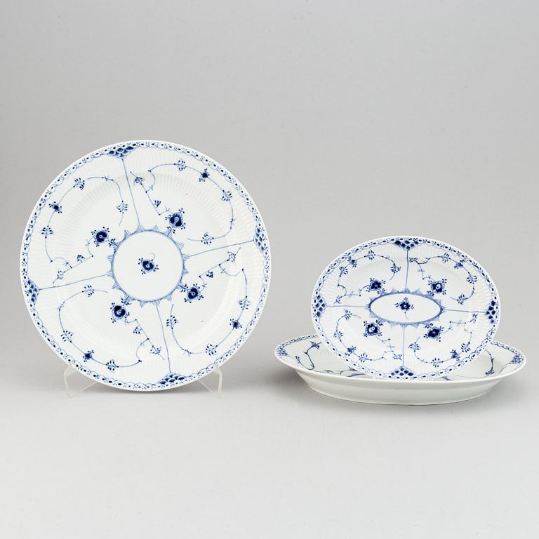 A 92 pcs half lace porcelain dinner-and coffee service, "Musselmalet" from Royal Copenhagen.