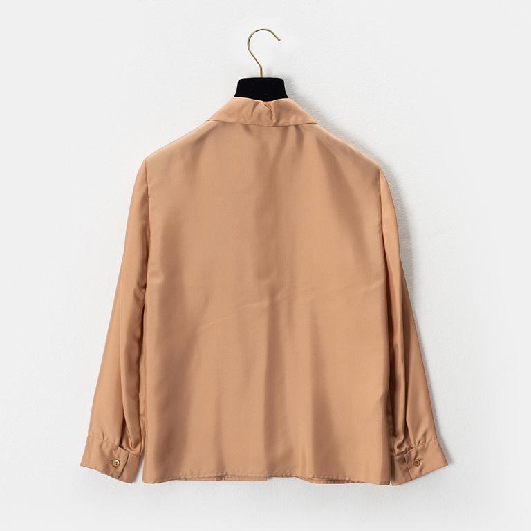 Prada, a apricot silk blouse, size 36.