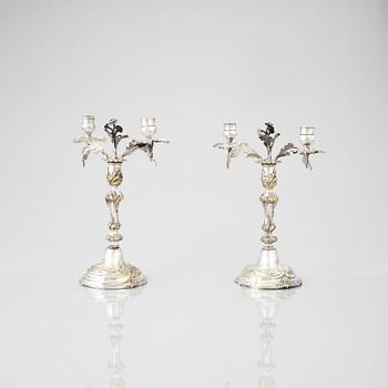 A pair of Swedish Rococo argent haché candelabra.