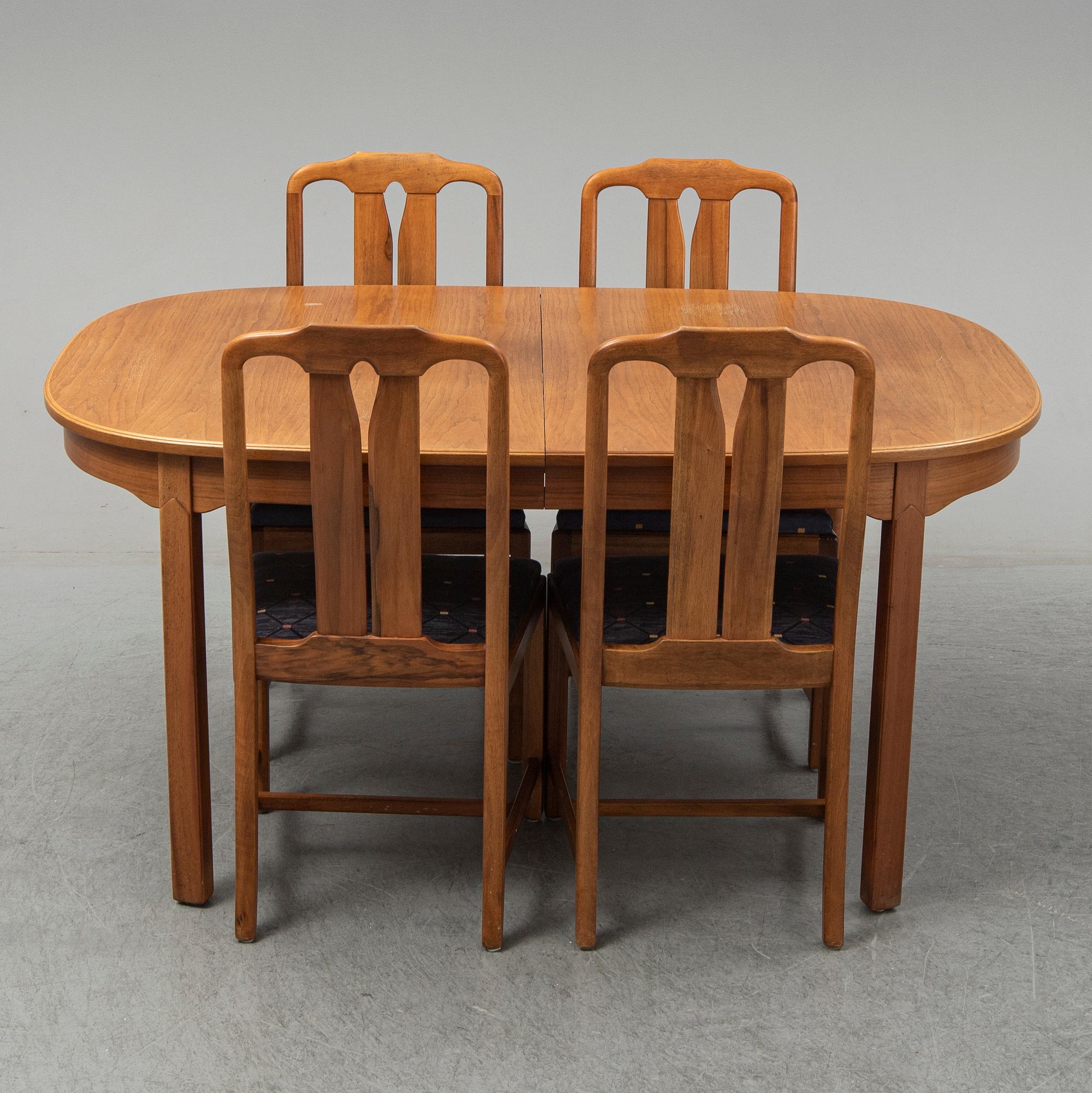 A five-piece walnut 'Ambassadör' dining suite by Carl Malmsten.