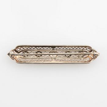 Brooch 14K white gold with round old-cut diamonds.