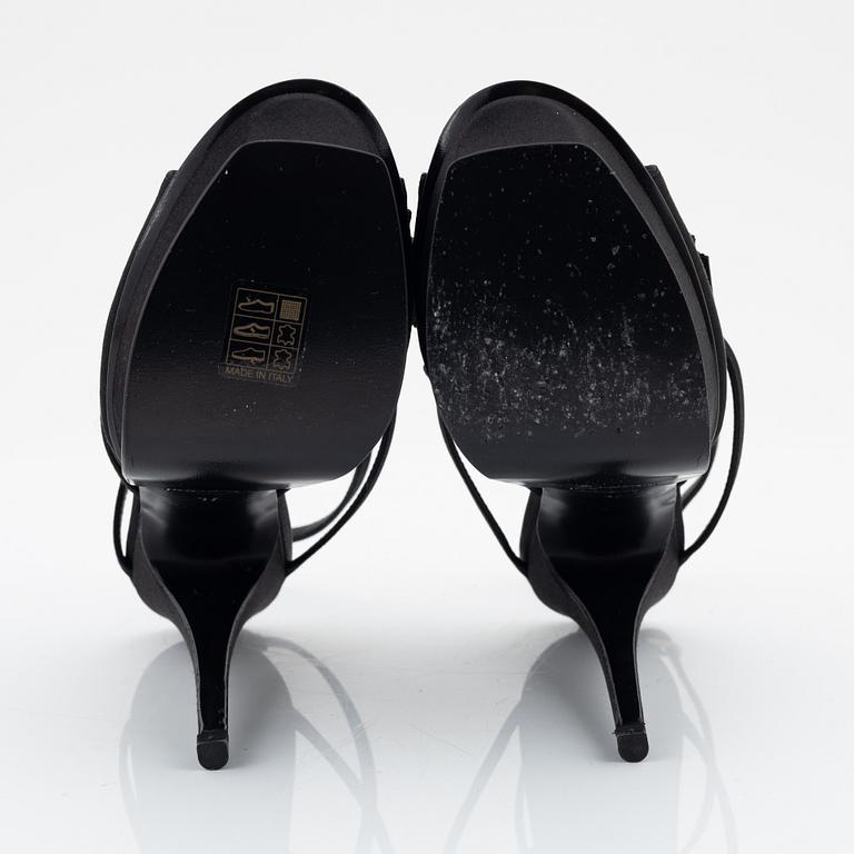 Yves Saint Laurent, a pair of black silk and bows platform sandals, size 37.
