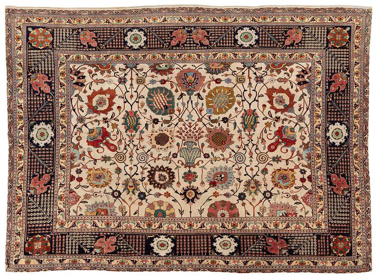 A semi-antique Tabriz carpet, Northwest Persia, of Safavid 'Vase' design, c.328 x 242 cm.