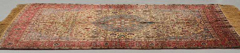 A rug, a semi-antique silk Turkish with metal brocade, ca 194-195 x 127,5-132,5 cm.