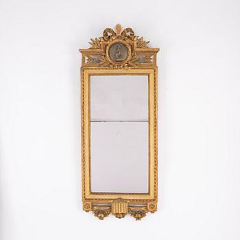 A signed Gustavian mirror dated 1785.