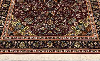 A part silk Tabriz rug, so-called 50 Radj, approx. 200 x 148 cm.