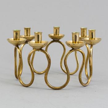 A Lars Holmström brass candle holder for seven candles, Svenskt Tenn, second half of the 20th century.