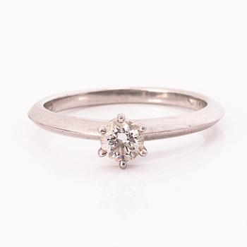 TIFFANY & CO, A platinum ring with a brilliant cut diamond ca. 0.3 ct.