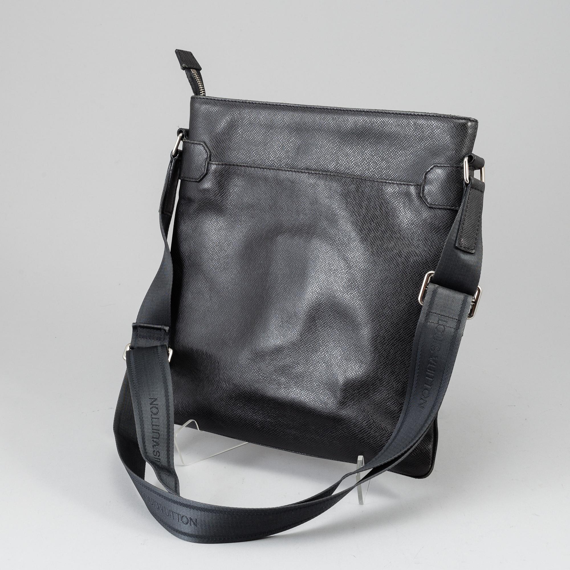 LOUIS VUITTON, a black Taiga bag, 2012.