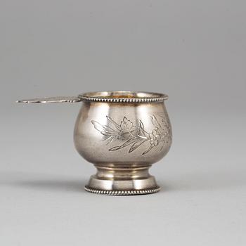 A Russian parcel-gilt silver vodka cup, Moscow 1888.