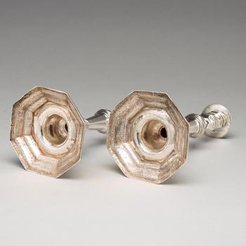 A pair of European 18th century silver candlesticks, unidentified makers mark.