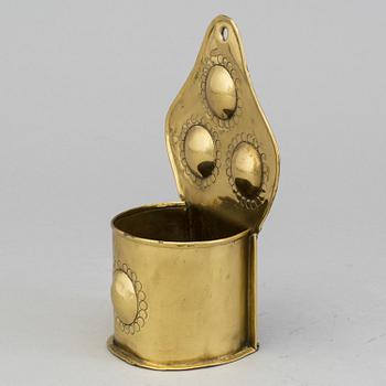 A 19th century brass spoon holder.