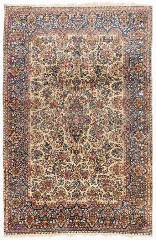 A carpet, Kerman, ca 323 x 213 cm.