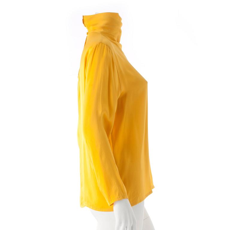 GUY LAROCHE, a yellow silk blouse.
