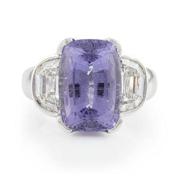A Gaudy platinum ring with a faceted purple tourmaline and step-cut diamonds.