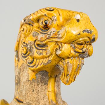 A yellow glazed fragment of a rooftile, Ming dynasty (1368-1644).