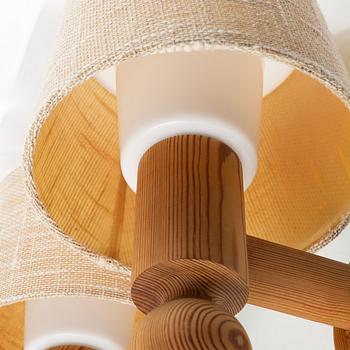 Uno & Östen Kristansson, a pair of pine wall lamps, Luxus, 1970s.