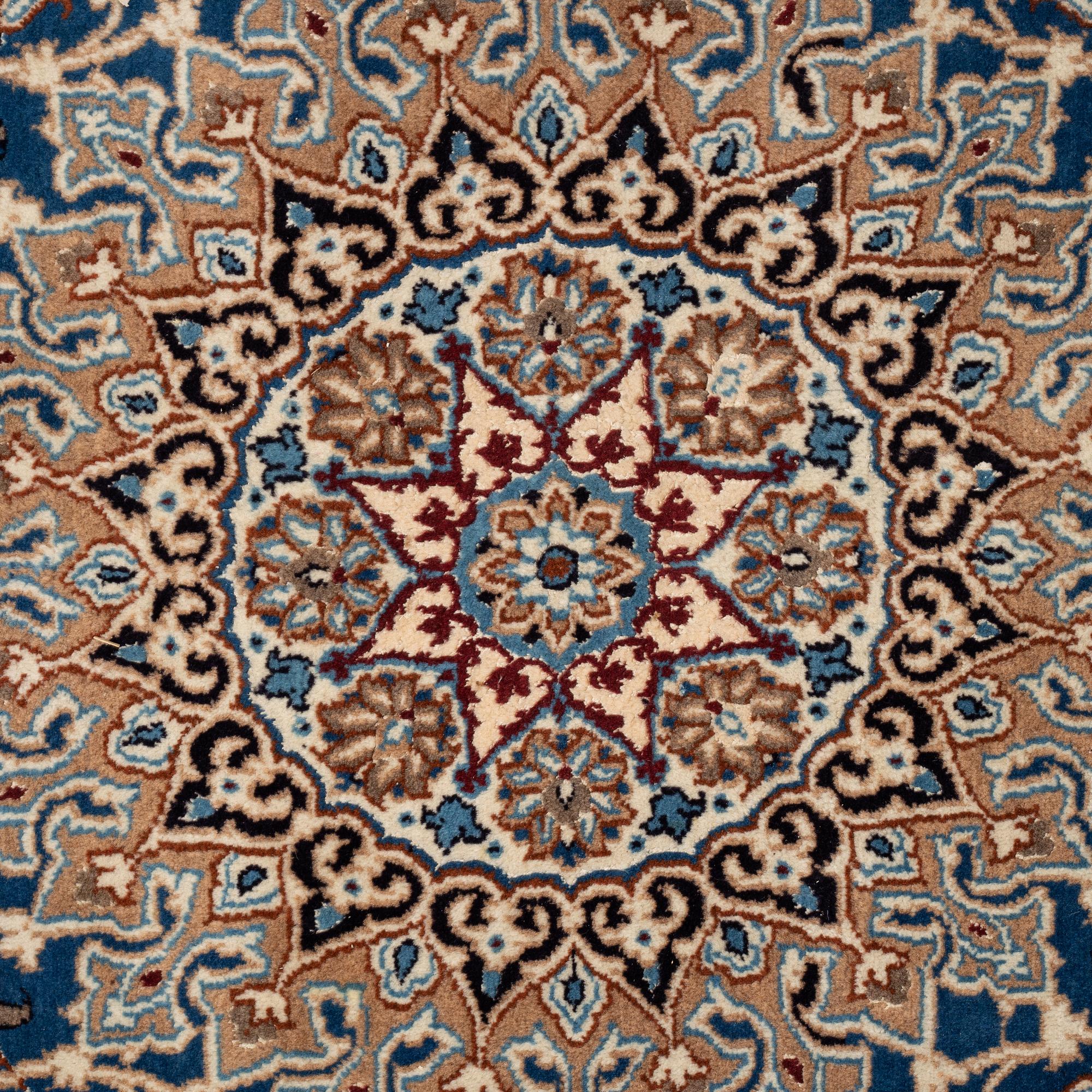 A carpet, Old Nain, part silk, ca 285 x 198 cm.