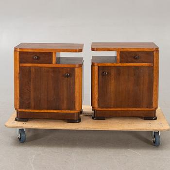 A pair of walnut/mahogany bedside tables first half of the 20th century.