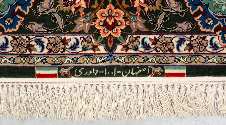 A rug, old Esfahan, part silk, signed, ca 225 x 149 cm (ca 1,5-2,5 cm flat weave at the ends).