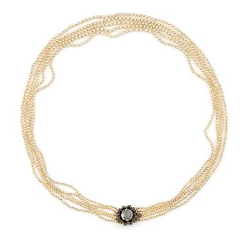 504A. A five-strand pearl necklace with a rose-cut diamond silver and 14K gold clasp with small rose-cut diamonds.