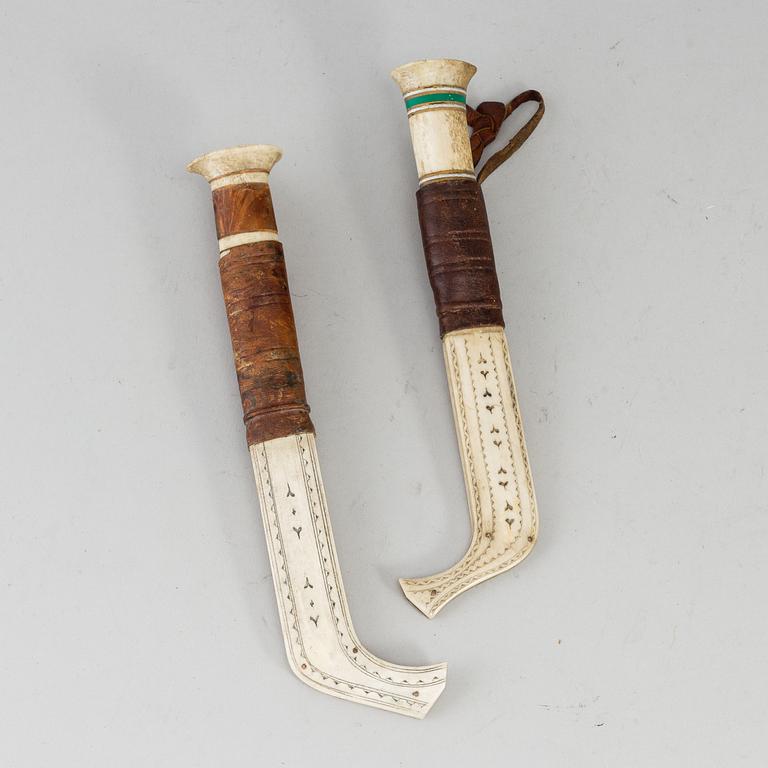 ERIK TUOLJA, two Sami reindeer horn knives, signed ET.