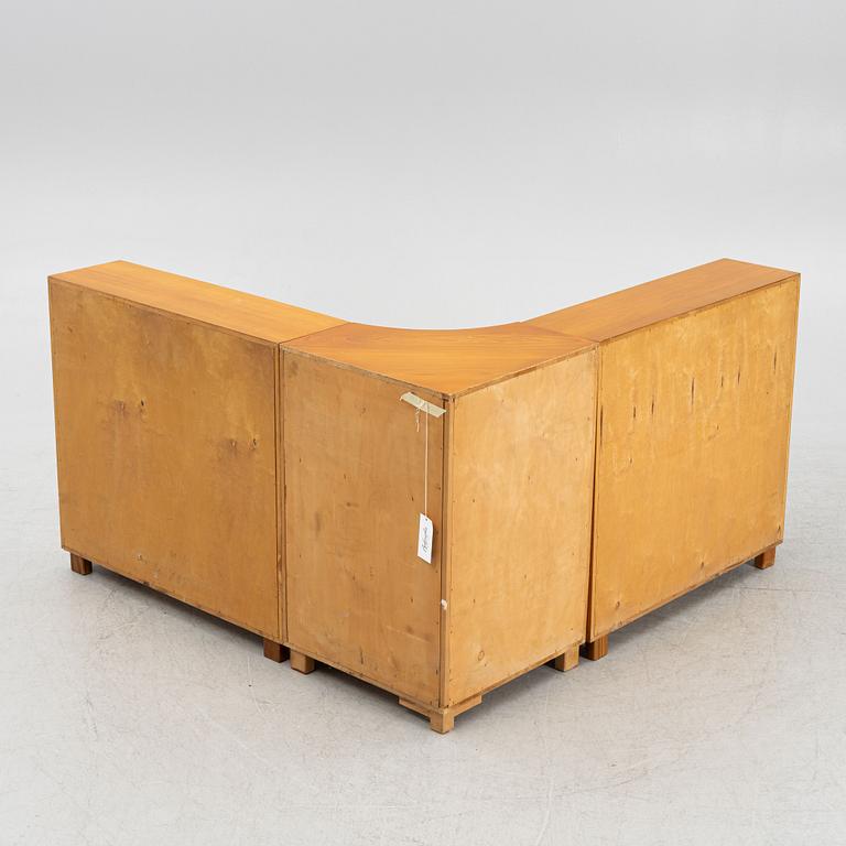 A corner bookcase, three sections, 1940's.