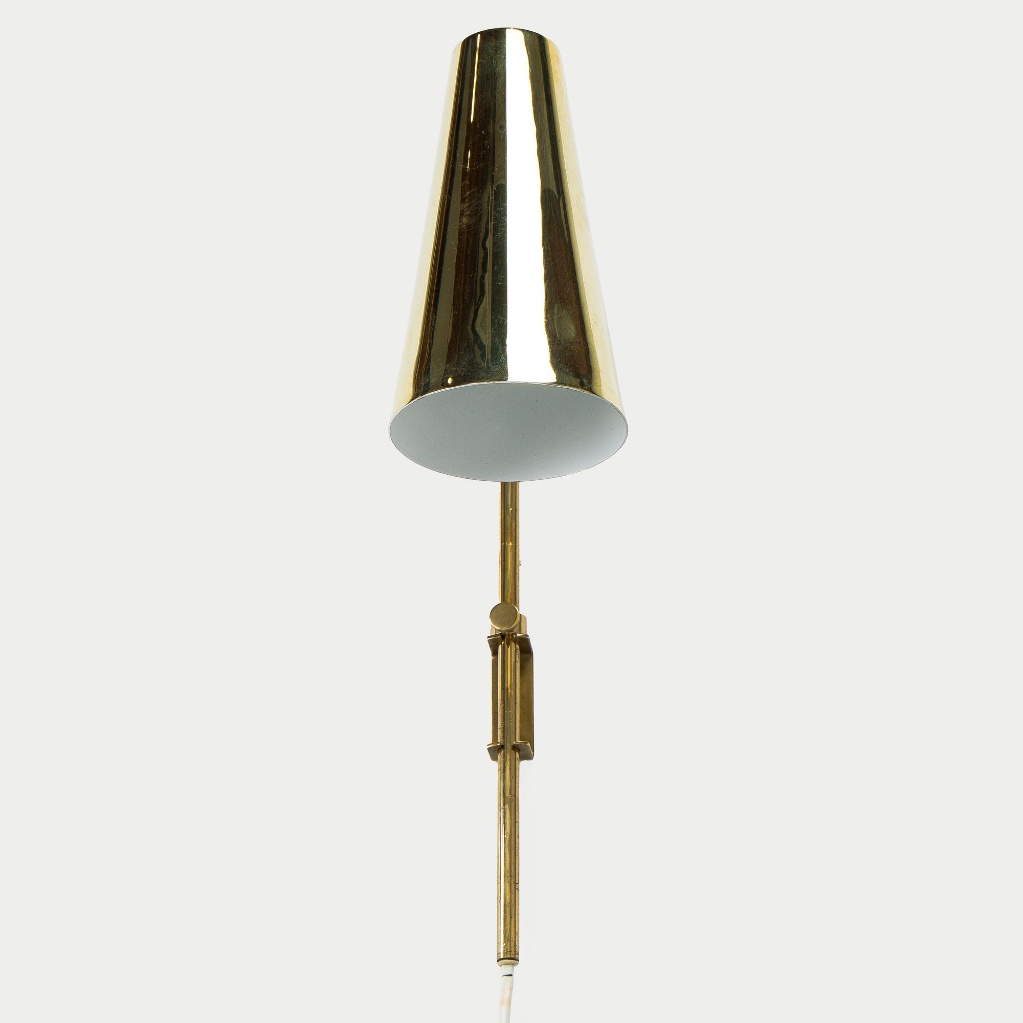 Paavo Tynell, a brass wall light model 9459, Idman, Finland 1960s.