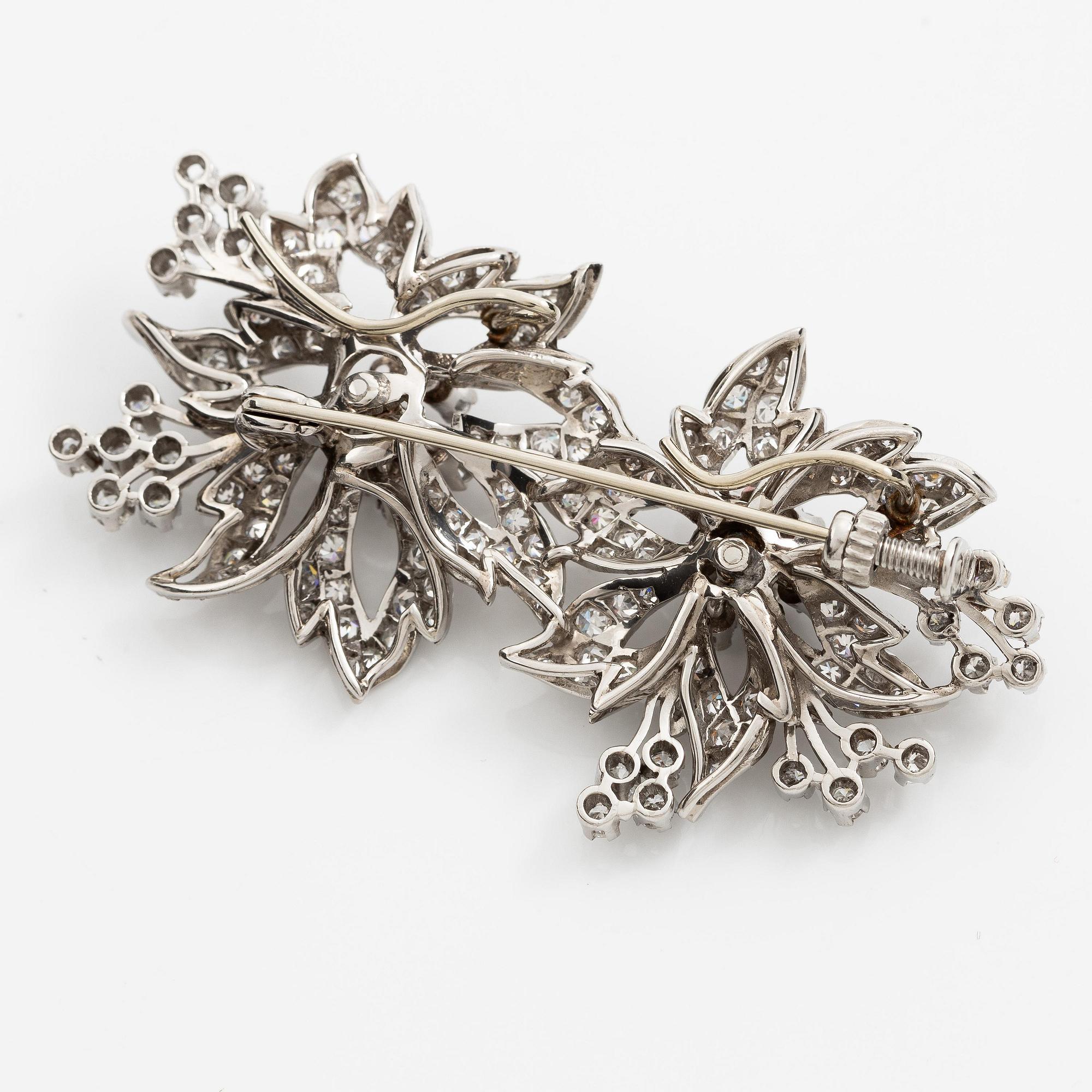 Brosch platina med runda briljant- och åttkantslipade diamanter.