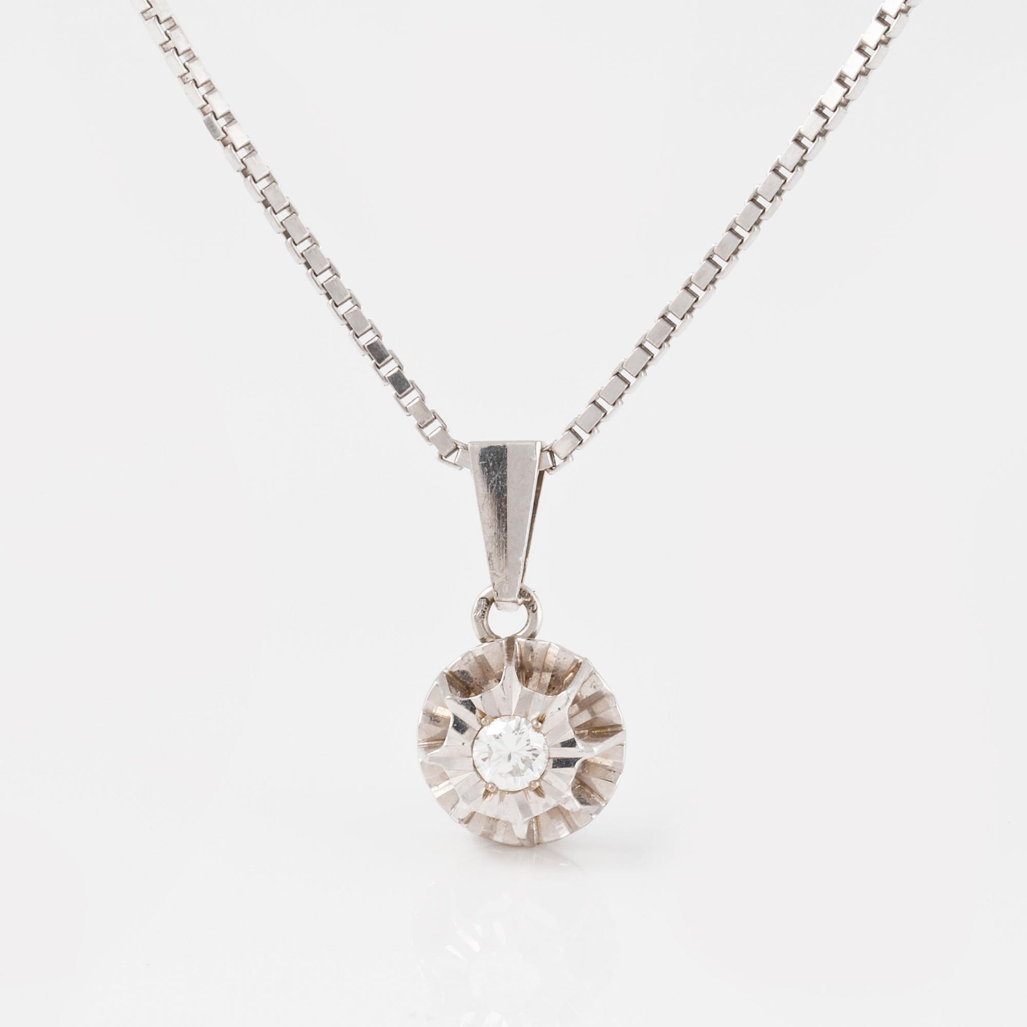 HÄNGE, 18K vitguld med briljantslipad diamant 0.20 ct. Vikt 8 gram.