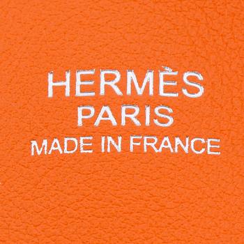 HERMÈS, a orange calf leather handbag, "Bolide".