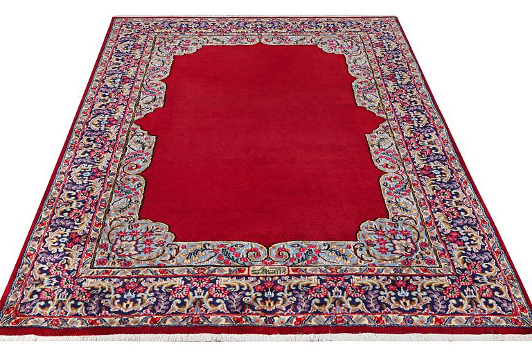 A Kerman carpet, signed Mirani, c. 290 x 208 cm.