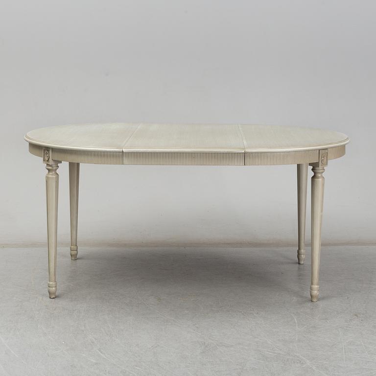 A dining table and six chairs, Gustavian style, second half of the 20th century. One leaf included.