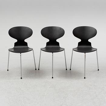 An Arne Jacobsen "Centenary Package" comprising three "Ant Chairs" and an eggshaped table, Fritz Hansen, Denmark.