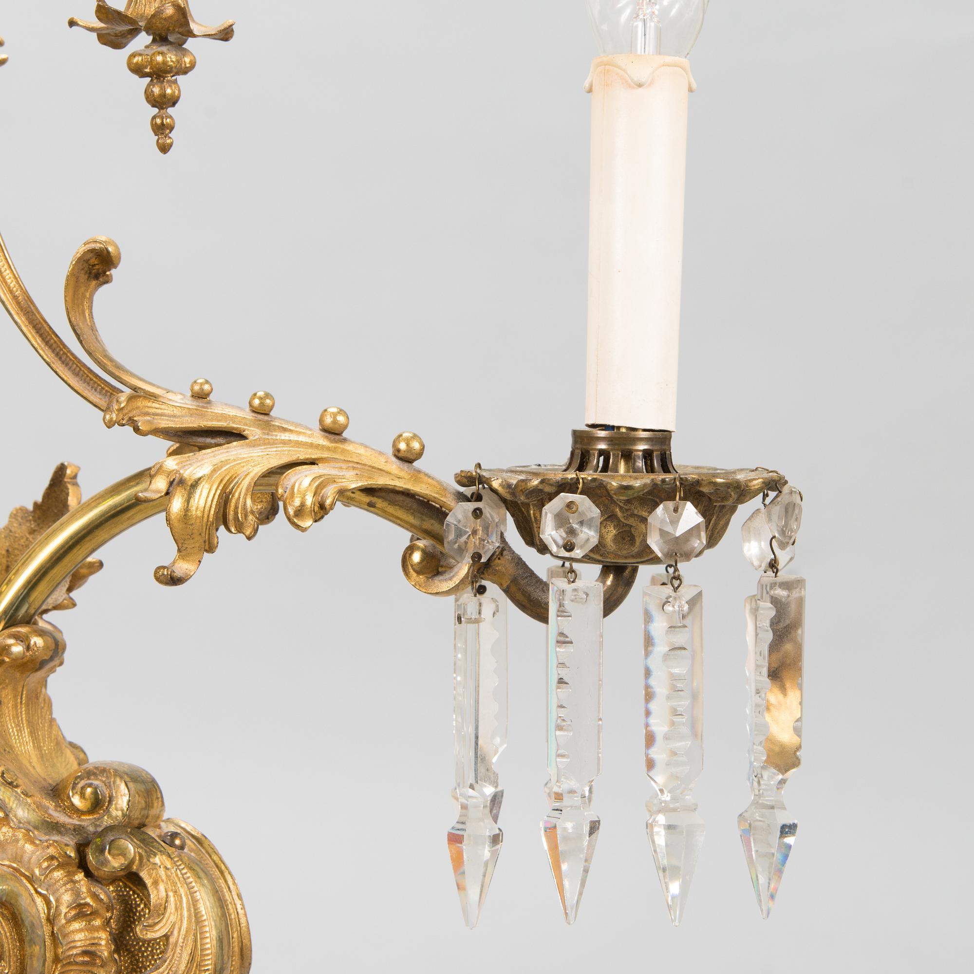 A brass chandelier with prisms, second half of the 19th century. Height 83 cm.