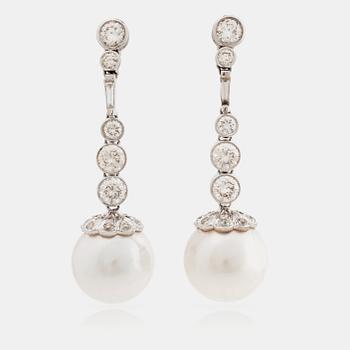 A pair of cultured south sea pearl and brilliant cut diamond earrings. Total carat weight of diamonds circa 3.30 cts.