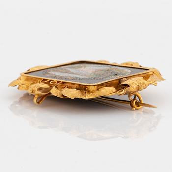 An 18K gold and micro mosaic brooch.