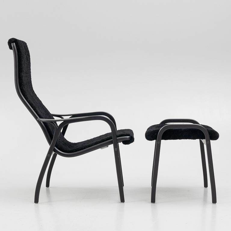 Yngve Ekström, a 'Lamino' easy chair with footstool, Swedese, 2018.