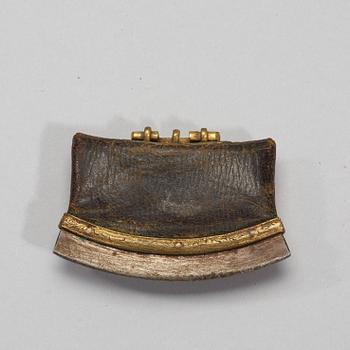A gilt bronze iron and leather tinder box, presumably Ming Dynasty, 17th century.