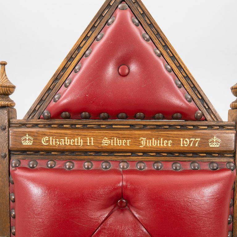 A oak and leather throne commemorating Elizabeth II silver jubilee 1977 by Wood Bros. Ltd.